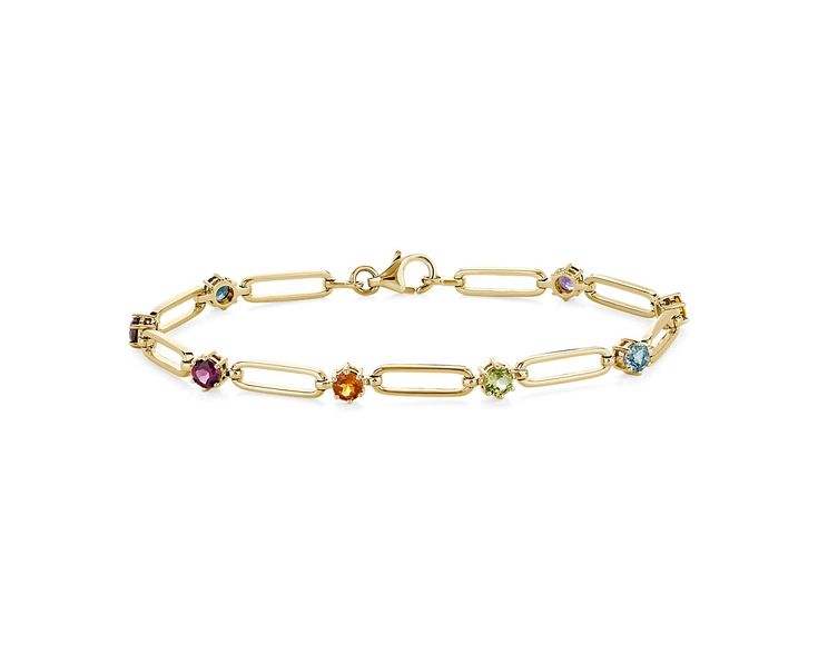 Elegantly unique, this bracelet features a paperclip design in lustrous 14k yellow gold. Between each link shimmers a delicate round-cut gemstone in an array of beautiful hues. Elegant Multicolor Gold Bracelet For Formal Occasions, Elegant Multicolor Gold Bracelet For Formal Events, Multicolor 14k Gold Bracelets For Formal Occasions, Classic Yellow Gold Bracelets With Multi-stone, Classic Yellow Gold Multi-stone Bracelets, Formal Yellow Gold Chain Bracelet With Gemstone, Formal Yellow Gold Gemstone Chain Bracelet, Elegant Yellow Gold Chain Bracelet With Gemstone, Elegant Oval Yellow Gold Paperclip Bracelet