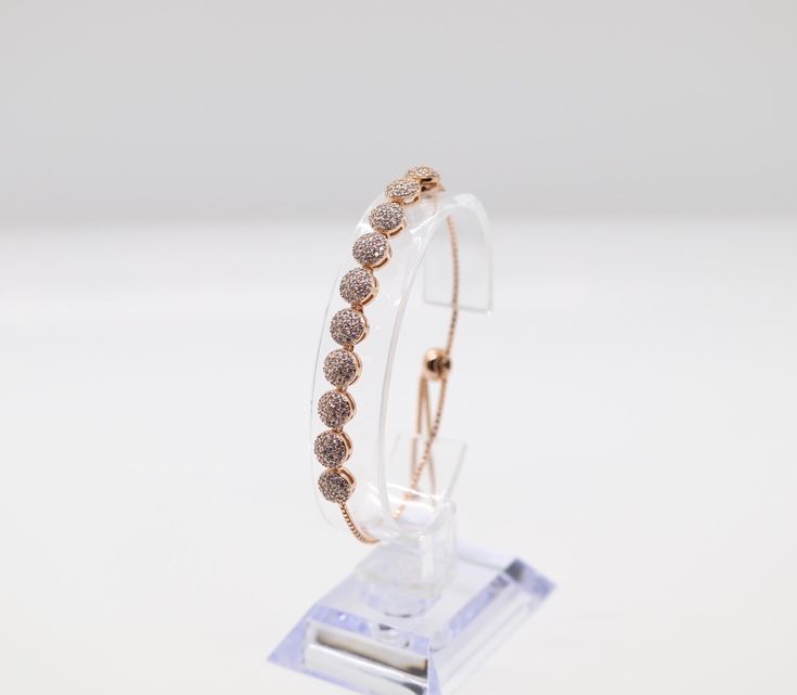 This bracelet is made of rose gold, which is a beautiful and durable material. The bracelet is designed to be worn by women and is available in a variety of sizes to ensure a comfortable fit. The bracelet is adorned with a delicate pattern that adds a touch of elegance to any outfit. Phone Items, Rose Gold Bracelet, Tennis Bracelet, Christmas Sale, Rainbow Colors, Gold Bracelet, Comfort Fit, Rose Gold, Bracelet