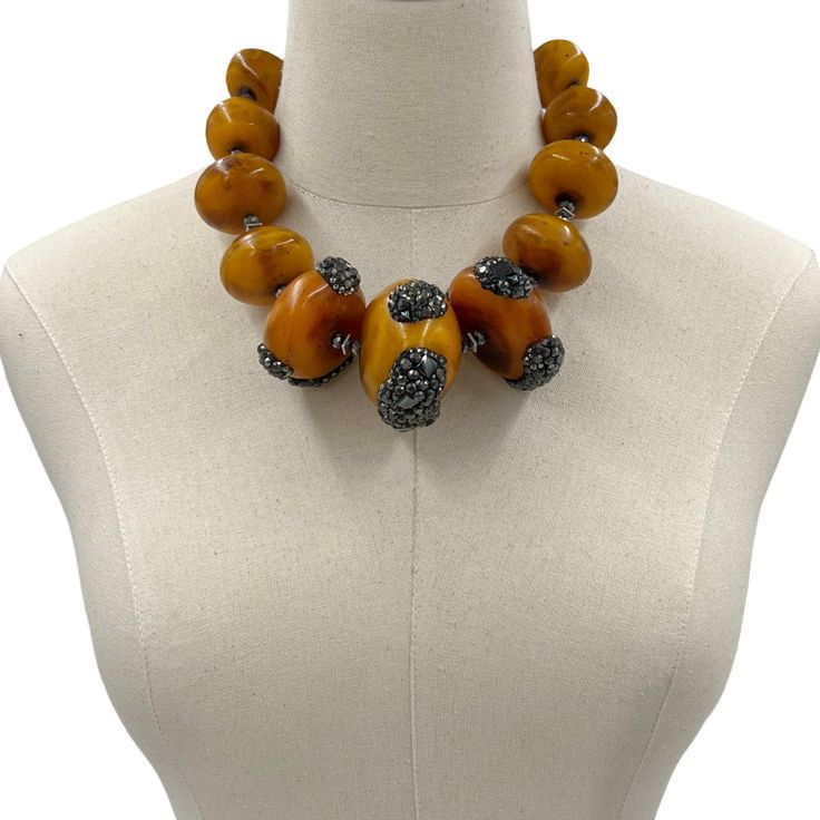 Reconstituted Amber Statement Necklace. Embellished wits Swarovski Crystals. Necklace Earring Set ONE OF A KIND DESIGNMETAL: Stainless SteelAPPROX SIZE: 20" Adjustable Length. Earrings 2"CLOSURE: Lobster Claw Clasp Amber Jewelry With Large Beads, Amber Jewelry With Large Round Beads, Amber Round Beaded Jewelry, Round Amber Jewelry With Large Beads, Luxury Handmade Orange Jewelry, Handmade Orange Formal Jewelry, Formal Handmade Orange Jewelry, Formal Orange Handmade Jewelry, Artisan Amber Jewelry With Polished Beads