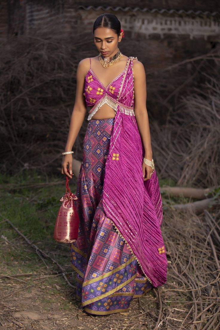 Pink and blue pure silk hand woven patola palazzo with twisted deep neck hand embroidered pink blouse. Paired twisted texture dupatta and potli bag.
Components:4
Pattern:Embroidered
Type of Work:Mirror, Resham
Neckline:V-neck
Sleeve Length:Sleeveless
Fabric:Palazzo: Banarasi; Blouse and Dupatta: Textured Silk
Color:Pink
Other Details:
Tassel hem blouse
Beaded hem blouse and dupatta
Back tie-up blouse
Layered palazzo
Comes with potli bag
Occasion:Destination Wedding - Aza Fashions Aditi Gupta, Banarasi Blouse, Potli Bag, Palazzo Set, Pink Mirror, Hem Blouse, Fashion App, Pink Blouse, Set For Women