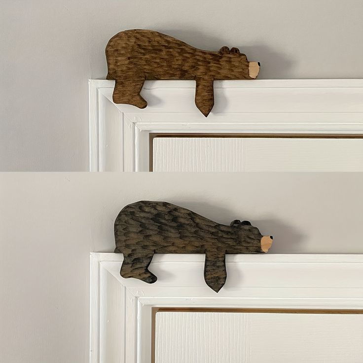 there are two wooden bears on the door knobs, one is brown and one is black