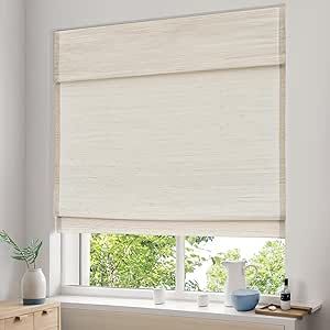 a bedroom with a window covered in white roman blind blinds and a dresser next to it