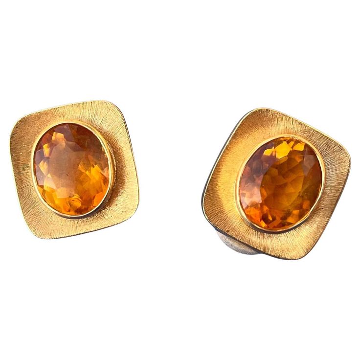 A beautiful pair of Citrine earrings designed by Burle Marx. The 4 carat faceted oval citrine displays a tangerine yellow hue, bezel set in an 18 karat yellow gold abstract design earrings. The backs of the earrings are signed "Burle Marx” and stamped "18K Brazil”. A designer, lapidary and gemologist, Haroldo ran a successful workshop in Rio from the 1930s through the 1980s. His exceptional work was a source of pride for the nation. When dignitaries visited Brazil, the government often commissioned Haroldo to create pieces to present to them. Japan’s Empress Nagako, for one example, received an opal necklace when she visited the country. Queen Margrethe of Denmark wore a Burle Marx demi suite of an aquamarine ring and brooch on her wedding trip in 1966. Other luminaries who had at least on Merle Oberon, Joan Bennett, Burle Marx, Natalie Wood, Citrine Earrings, Aquamarine Rings, Opal Necklace, Bezel Setting, Designer Earrings