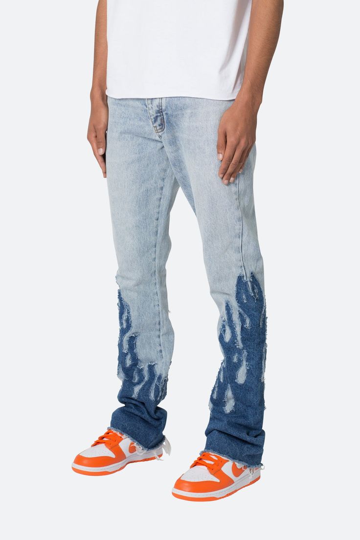 the B556 Flame Flare Denim are designed with our new B fit, which is slim through the thigh and features a slight flare at the leg opening and is constructed from light washed blue denim, panelling at the inseam and outseam from contrasting blue denim for a slight flare and finished with contrasting self fabric flame p Medium Wash Ripped Flare Jeans In Rigid Denim, Ripped Flare Jeans In Medium Wash Denim, Distressed Blue Flare Jeans, Blue Flare Jeans With Five Pockets, Faded Flare Denim Jeans, Blue Distressed Flare Jeans, Fitted Washed Blue Jeans With Frayed Hem, Fitted Distressed Flare Jeans In Rigid Denim, Faded Denim Flare Jeans With Five Pockets