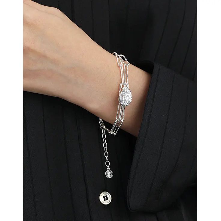 Office Double Layers Hollow Chain Lotus Leaf 925 Sterling Silver Bracelet Elevate your office attire with the exquisite Office Double Layers Hollow Chain Lotus Leaf 925 Sterling Silver Bracelet. Crafted with meticulous attention to detail, this bracelet effortlessly combines elegance and modernity, making it a must-have accessory for any professional setting. Key Features: Pendant Size: 16.3mm Metal Material: Solid 925 Sterling Silver Metal Electroplating: Rhodium for a brilliant, long-lasting s Formal Silver Chain Bracelet With Adjustable Chain, Elegant Silver Chain Link Bracelet, Elegant Oyster Link Chain Bracelet, Elegant Silver Chain Charm Bracelet, Sterling Silver Bracelet With Adjustable Chain For Formal Occasions, Adjustable Sterling Silver Formal Bracelet, Elegant Silver Chain Bangle Bracelet, Elegant Silver Chain Bracelet Gift, Elegant Silver Chain Bracelet For Gifts