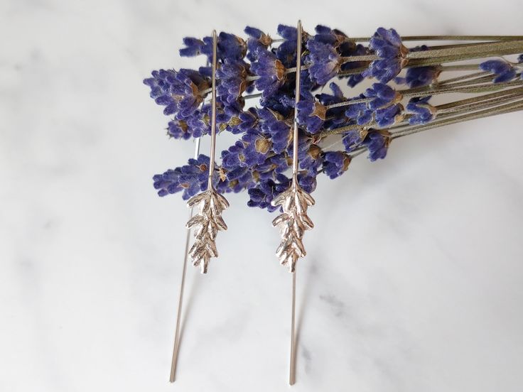 This beautiful pair of lavender earrings is inspired by nature. They have been individually handcrafted of recycled silver. I make them in the shape of an actual lavender flower. So they are one of a kind piece of jewellery. Earrings are light and comfortable. Dimensions: Size of lavender flowers is approx. 0.7 x 0.3 in (18 mm x 8 mm). Lenght of earrings is approx. 2.8 in (71 mm). Lavender flowers represent purity, silence, devotion, serenity, grace, and calmness. This earrings are Made to Order Affordable Handmade Lavender Jewelry, Cheap Lavender Jewelry For Gifts, Cheap Lavender Jewelry For Gift, Cheap Handmade Lavender Jewelry, Cheap Lavender Hypoallergenic Jewelry, Luxury Lavender Earrings As Gift, Cheap Lavender Flower Shaped Jewelry, Cheap Lavender Flower-shaped Jewelry, Lavender Jewelry