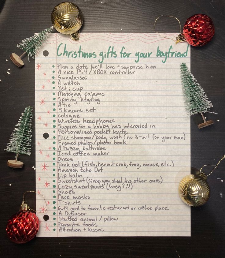 a christmas gift list with ornaments and bells around it on top of a piece of paper