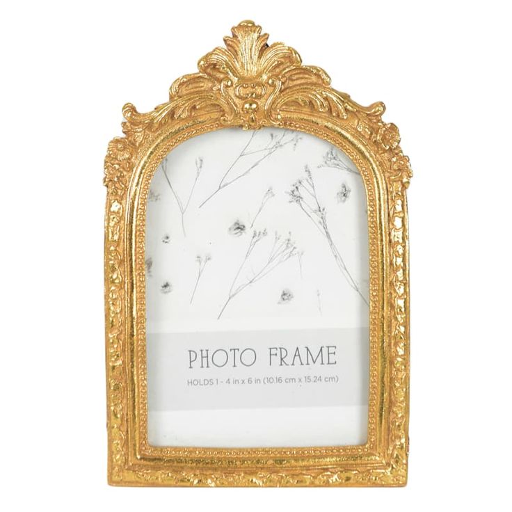 an ornate gold frame with white marble in the middle and floral designs on the sides