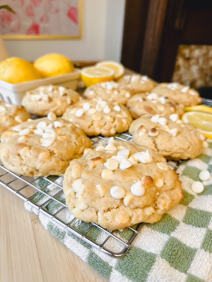 cookies with white chocolate chips and lemons on a cooling rack