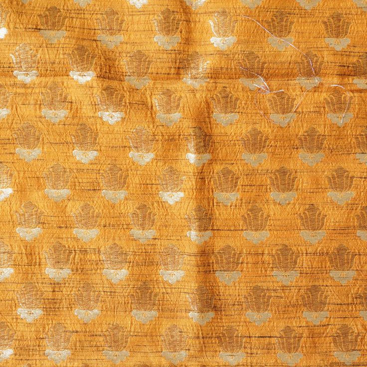 Design your own outfits from Khinkhwab’s exclusive fabrics range. This is an intricately designed Pure Tussar fabric. A definite pick this festive season that makes you look traditional yet trendy. Weave- Banarasi Fabric - Pure Tussar Silk The price mentioned here is for 1 meter. Note- There may be slight color variations due to photographic reasons. This is a hand-woven product and any irregularities in the weaving or pattern should not be taken as a defect. These irregularities make every hand Festive Gold Raw Silk Fabric, Gold Fabric With Zari Weaving For Festive Season, Gold Brocade Fabric With Zari Weaving For Festivities, Gold Brocade Fabric With Zari Weaving For Festive Occasions, Gold Brocade Dupatta With Woven Motifs, Gold Art Silk Fabric For Festivals, Festive Gold Fabric With Zari Weaving, Festive Brocade Fabric With Zari Work, Festive Banarasi Silk Fabric In Gold