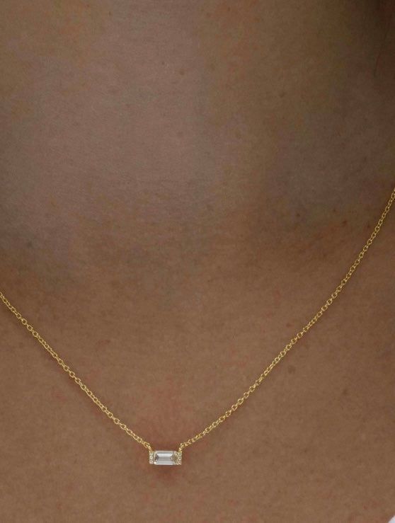 This beautiful and dainty baguette necklace is available in thick and durable rhodium plated .925 sterling silver or 14K gold plated .925 sterling silver. The CZ stone is approximately 4x6mm. The natural ashes will be set behind the stone so the stone color may vary depending on the ash color showing through. Mailing instructions for your ashes can be found on the main page of the website. Please mail them to me ASAP. You can order a prepaid shipping kit if you would like, but it is not required Emerald Cut Diamond Necklace In 14k Gold, Dainty Gold Baguette Cut Necklace, Minimalist Gold Baguette Cut Necklace, Dainty Jewelry With Baguette Emerald Cut Diamonds, Dainty Baguette Diamond Jewelry For Anniversary, Dainty Emerald Cut Baguette Diamond Jewelry, Minimalist 14k Gold Baguette Cut Necklace, Delicate White Gold Baguette-cut Jewelry, Everyday 14k Gold Baguette Diamond Jewelry