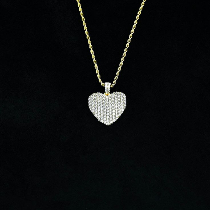 Radiate LOVE with this yellow gold iced diamond heart pendant necklace. This piece features flawless stones embedded into glimmering yellow gold. This diamond covered heart pendant is the perfect gift to show your love for someone special in your life. Shine in this diamond heart pendant today! Gold Presidents brings you the highest standard of jewelry. Specifications Material Options 18k Yellow Gold Plated Stones: Cz Stones What chains can fit this pendant? Up To 3mm Tennis Chain Shipping EXPRE Ice Heart, Radiate Love, Diamond Heart Pendant Necklace, Diamond Ice, Tennis Chain, Heart Pendant Diamond, Heart Pendant Necklace, Diamond Heart, Cz Stone