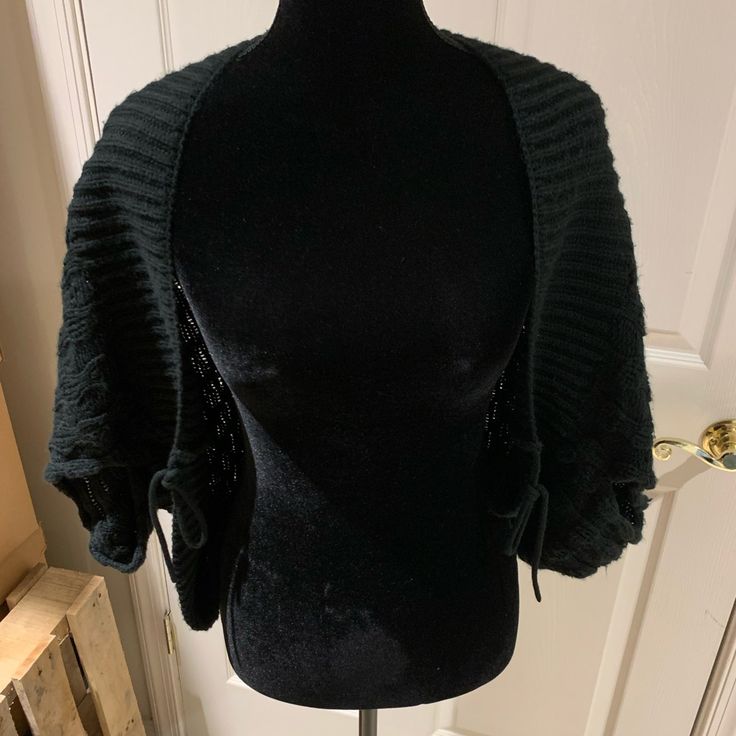 Black Sweater Shrug Black, Crocheted Shrug From Vertigo Paris. New With Tags. Features: Tie Front Shrug Style Fabric: 100% Acrylic Care: Hand Wash Or On Delicate Cycle On Front-Loading Machine. Reshape And Dry Flat. Original Retail: $240 Measurements Are In Inches. Shoulder: Dolman Sleeve. No Clear Shoulder Seam. Chest: 38 Waist: Not Applicable Length From Shoulder: It Will Be Short. As A Shrug, The Length Will "Ride Up" In The Back. Sleeve Length: Dolman Short. 12" From Top Black Shrug For Night Out In Fall, Trendy Black Shrug For Fall, Trendy Black Winter Shrug, Black Evening Shrug For Winter, Chic Black Winter Shrug, Elegant Black Winter Shrug, Black Knit Shrug, Elegant Long Sleeve Black Shrug, Black Fitted Cropped Shrug