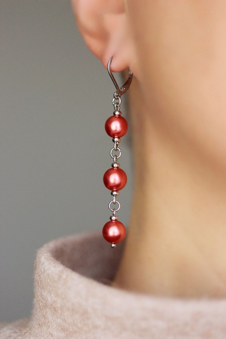 Unique pearl earrings with bright red-pink high quality czech glass pearl coated 8 mm beads, tiny stainless steel beads-separators, steel jumping ringa and stainless steel lever back earring hooks. Earring hooks are from nickel free and lead free metal. The total lenght of earrings is about 65 mm including earring hooks. Perfect jewelry for everyday wear and a great gift! Other earrings of my shop you can see here: https://www.etsy.com/shop/NaTavelli?section_id=13757927 Thanks for visit! Red Round Pearl Drop Earrings, Red Pearl Drop Round Earrings, Red Dangle Pearl Earrings For Party, Red Drop Pearl Earrings For Gift, Red Dangle Pearl Earrings For Jewelry Making, Handmade Red Pearl Earrings, Handmade Red Round Pearl Earrings, Red Pearl Drop Earrings, Elegant Red Dangle Pearl Earrings