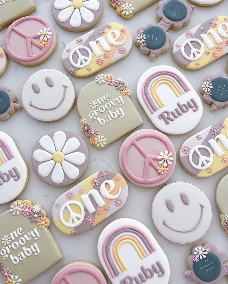 some decorated cookies are laying on a table