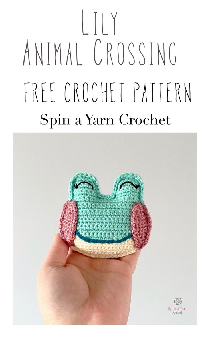 a small crocheted frog sitting on top of a white surface with text overlay that reads lily animal crossing free crochet pattern spin a yarn crochet