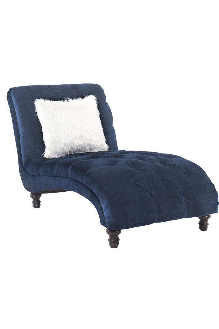 a blue chaise lounge chair with a white pillow on the top and bottom part of it