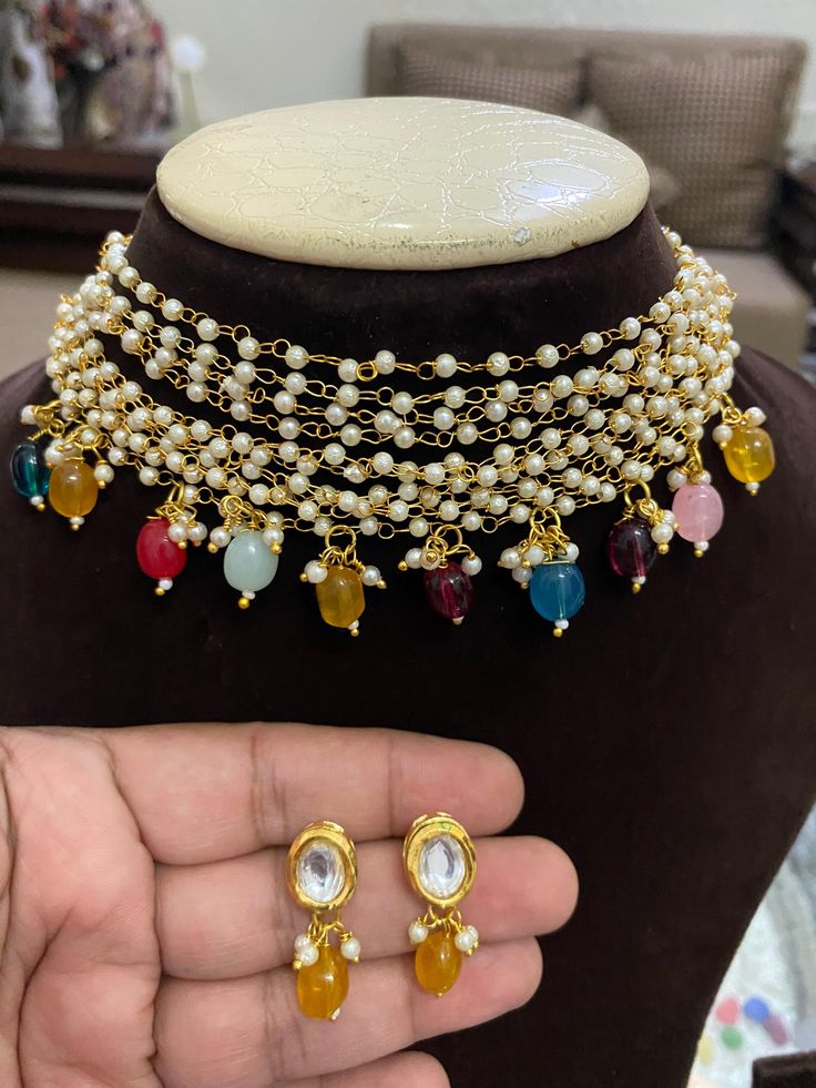 *Beautiful Monalisa Stone Jewelry Necklace *Comes With Matching Earrings For any query please DM us *Chinni Beads And Monalisa Stona Are Of Original Quality *Chinni Beads Are So Soft *Necklace Fitting Is Adjustable *Earring Closure: Push Back *For More Beautiful Collection, Check At https://www.etsy.com/shop/placeoffashion **Necklace Closure : Silk Thread *It is a Bridal or Partywear Set. *It Will Give You a Unique and Beautiful Look  *You Can Wear This Beautiful Set At Dress or Saaree  *The Colour Combination Of This Set Is Very Unique , It can go With Any Of The Outfit *If You Want Any Particular Item Please Message Us , We Are Having Alot More Items In Stock. You can Share The Pic Also Of the Item That You Want, We Will Be Really Happy To Serve You *Follow Us To See More Collection *It Multicolor Tilla Jewelry For Gifts, Multicolor Heavy Jewelry For Celebration, Elegant Multicolor Latkans Necklace, Multicolor Celebration Jewelry, Bohemian Pearl Drop Jewelry For Festive Occasions, Bohemian Style Pearl Drop Jewelry For Festive Occasions, Bohemian Festive Jewelry With Pearl Drop, Traditional Pearl Necklace With Dangling Beads As A Gift, Bollywood Style Dangling Beads Jewelry For Festivals