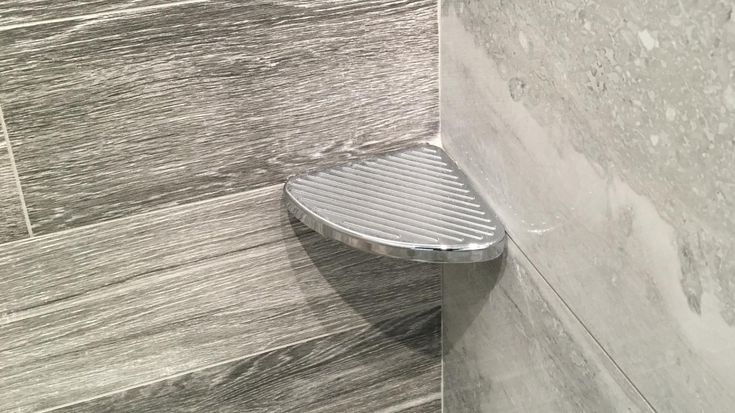 a close up of a shower head in a bathroom