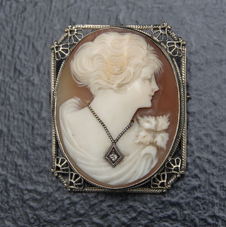 "c1920 14k White Gold Cameo with Diamond Pendant/Brooch. Really nice quality hand carved victorian cameo with diamond pendant. Tested and marked 14k gold, Diamond is tested real. 1.5\" tall x 1 1/8\" wide 8.1 grams total weight. The top loop is hinged to come up when using as a pendant or down when wearing as a brooch." Victorian Revival, Antique Signs, Gold Diamond Engagement Rings, Cameo Jewelry, Vintage Cameo, Carved Shell, Cameo Brooch, Jade Carving, Gold Filigree