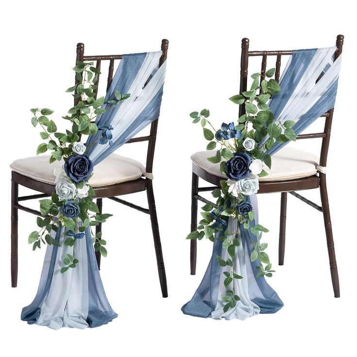 two chairs decorated with blue flowers and greenery