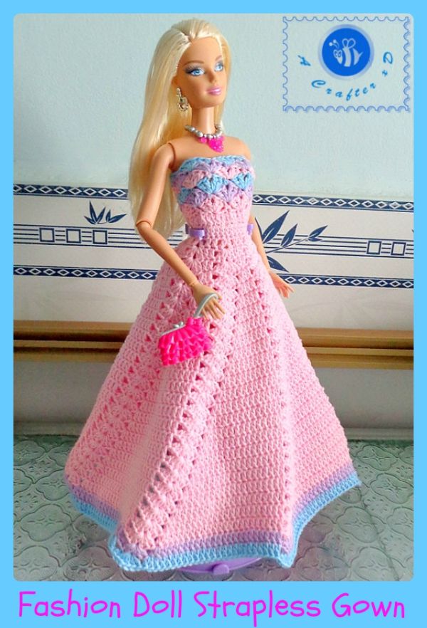 a barbie doll is wearing a pink dress