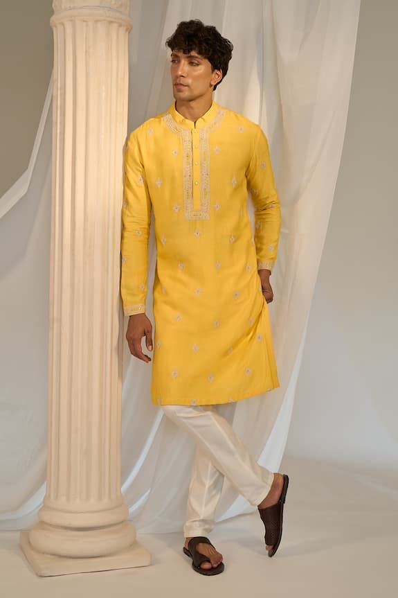 Yellow kurta with floral embroidered placket, cuff and scattered buttis. Comes with contrasting pyjama pant. - Aza Fashions Fitted Traditional Wear With Embroidered Sleeves For Eid, Festive Sherwani With Embroidered Sleeves For Wedding, Designer Wear Fitted Kurta With Embroidered Border, Designer Fitted Kurta With Embroidered Border, Eid Long Sleeve Kurta With Embroidered Cuffs, Long Sleeve Kurta With Embroidered Cuffs For Eid, Chanderi Traditional Wear With Embroidered Sleeves For Wedding, Fitted Kurta With Embroidered Border For Transitional Season, Embroidered Traditional Wear For Wedding And Eid