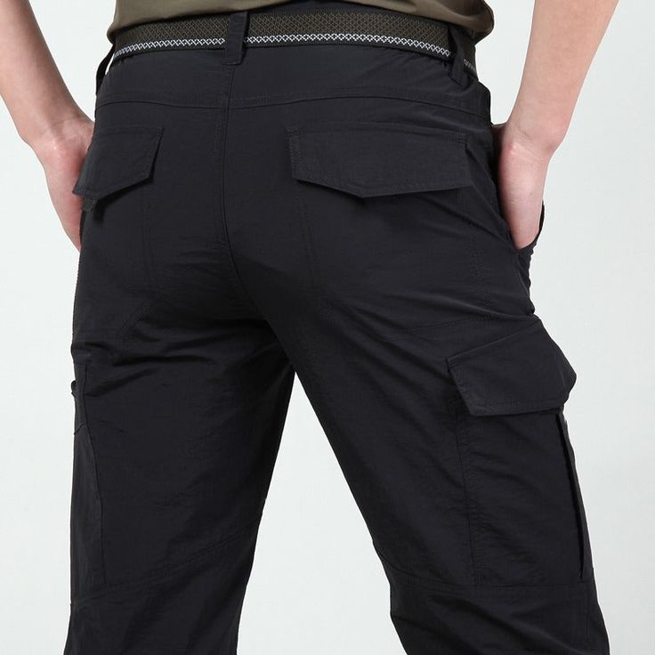 Introducing our Men's Outdoor Waterproof Tactical Cargo Pants, perfect for the summer season and beyond. Made with premium-quality polyester and spandex, these pants offer both style and comfort. Here are some features and benefits to keep in mind: Premium-quality materials: Our tactical cargo pants are made with high-quality polyester and spandex, ensuring durability, comfort, and flexibility. They are designed to last, even with frequent use. Lightweight and breathable: These pants are perfect Tactical Cargo Pants, Quick Dry Pants, Warm Pants, Tactical Pants, Long Trousers, Mens Cargo, Mens Pants Fashion, Mens Dress Pants, Hiking Pants