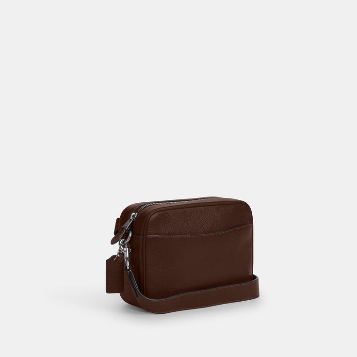 Our Warner Crossbody Bag is a timeless compact essential. Crafted of refined pebble leather it features everything you'd want in an on-the-go bag: a secure zip closure interior card slots and pockets and a spacious exterior pocket to keep your most-used items handy. This men's leather crossbody bag also converts into the perfect travel pouch thanks to its convenient removable strap. No matter the occasion this designer leather crossbody bag helps you stay organized in style. Classic Formal Shoulder Bag With Cell Phone Pocket, Classic Phone Bag For Travel, Classic Business Belt Bag Satchel, Classic Crossbody Belt Bag, Classic Rectangular Belt Bag For Business, Classic Rectangular Business Belt Bag, Functional Business Crossbody Phone Bag, Modern Business Phone Bag With Adjustable Strap, Modern Business Shoulder Phone Bag