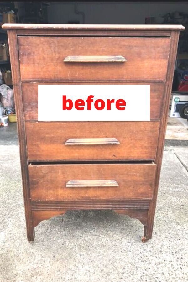 an old wooden file cabinet with the words before painted on it's bottom drawer