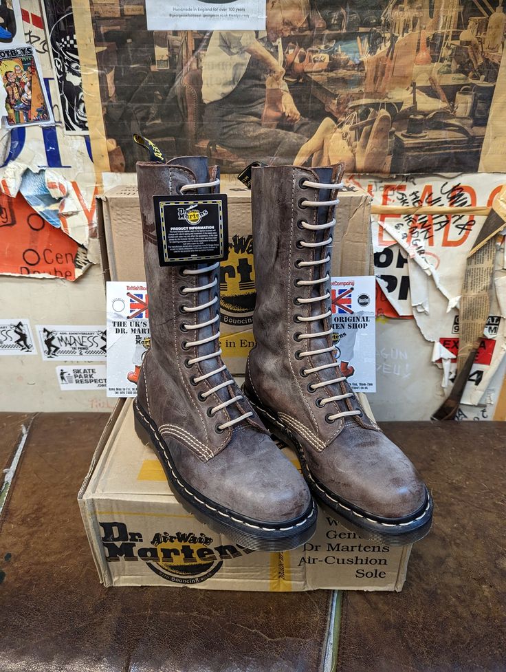 These boots are truly vintage, original,unworn Made in England Dr Martens from the 1990s. They are a premium quality in terms of it's leather upper and rarity. The leather is a washed looked finish. Is very striking and pleasing on the eye. It's also a brilliant quality leather. The stitching iis a beige colour that compliments it perfectly. We have size 3-6.5 available Retro Lace-up Leather Boots, Vintage High-top Leather Boots, Vintage Leather High-top Boots, Vintage Distressed Brown Boots, Vintage Leather Lace-up Boots, Grunge High Ankle Leather Boots, Vintage Leather Knee-high Lace-up Boots, Vintage Boots With Reinforced Heel For Winter, Vintage Winter Boots With Reinforced Heel