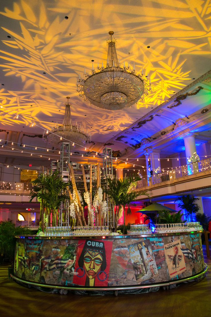 an elaborately decorated lobby with chandelier and art work on the ceiling above