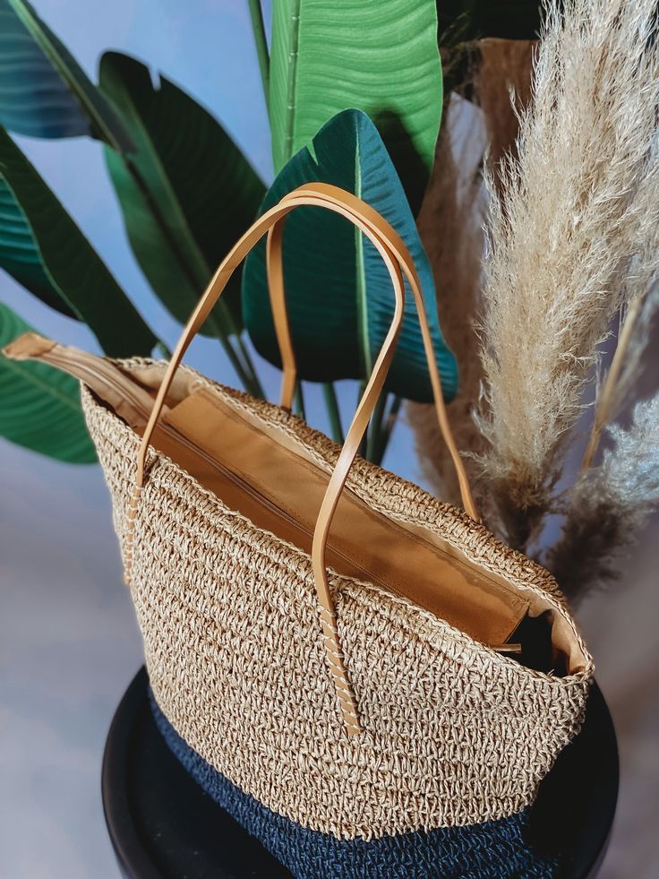 This stylish and sustainable Boho Living Straw Tote Bag is perfect for all your beach day needs! Made from natural jute, this tote is sure to turn heads with its neutral hues. No more lugging around your beach gear - pack it up in this tote bag for a fashionable way to hit the waves! Custom Trucker Hats, Straw Tote Bag, Beach Gear, Straw Tote, Jumpsuit Shorts Rompers, Boho Living, Loungewear Sets, Natural Jute, Shoe Sale