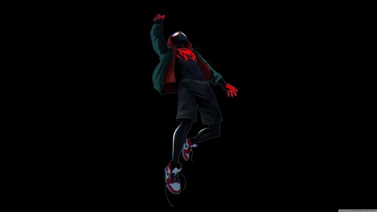 a person jumping in the air on a skateboard with their arms up and legs spread out