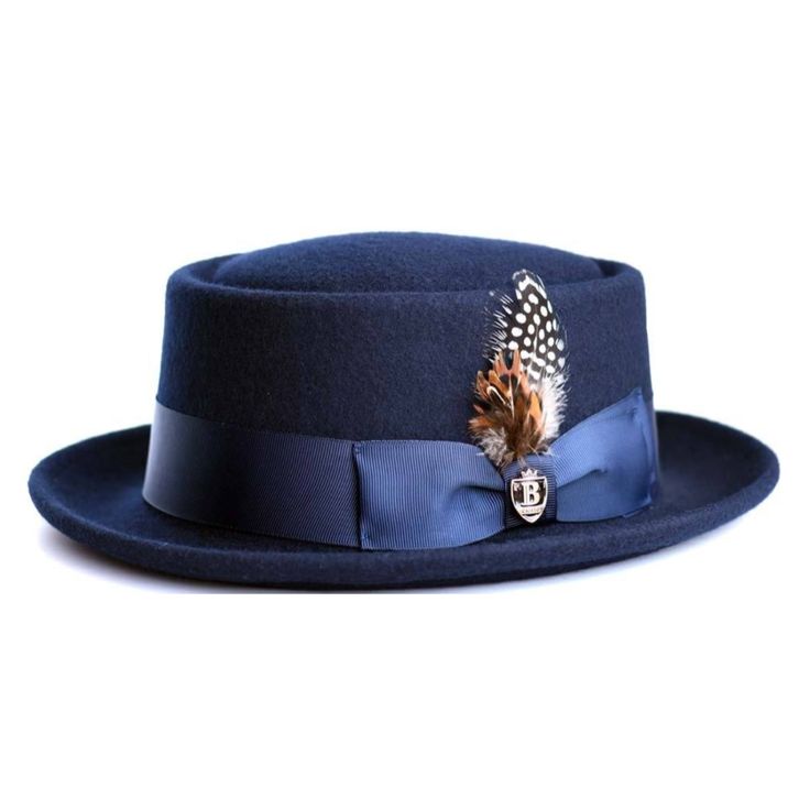 Bruno Capelo If you’re looking to add a piece of history to your outfit, then this wool felt pork pie hat is the hat for you. The oval telescope crown is surrounded by a classic grosgrain ribbon hat band that is finished with a single bow. Featuring a 2" bound brim and semi-crushable construction you will definitely stand out of the crowd with this shape! Brim: 1 7/8" Bound Material: 100% Fine Australian Wool Crown Height: 3.5" Interior: Elasticized Leather Sweatband Hat Band: 1.5"19-Ligne Sweat Rico Suave, Bailey Hats, Kangol Hats, Pork Pie Hat, Black Men Fashion Swag, Pork Pie, Farmhouse Furniture, Navy And Brown, Black Men Fashion