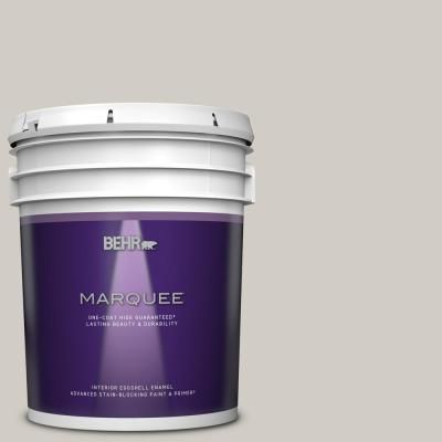 a bucket of behr marquee paint on a beige background with the lid open