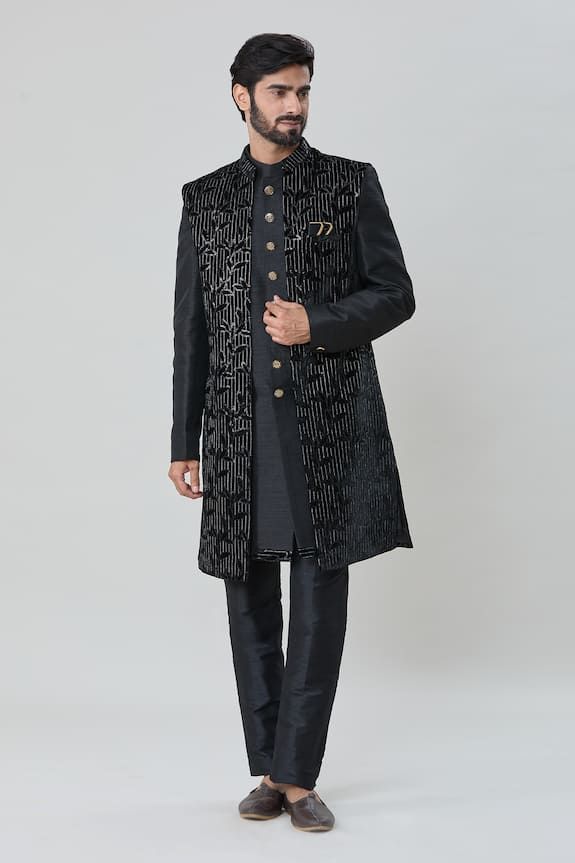 Black sleeveless jacket with all over leaf vine embroidery, sequin highlights. Paired with an inner sherwani and aligadhi pant. - Aza Fashions Fitted Festive Outerwear With Embroidered Sleeves, Festive Black Outerwear With Intricate Embroidery, Black Resham Embroidered Outerwear For Festive Occasions, Black Outerwear With Resham Embroidery For Festive Occasions, Black Festive Outerwear With Resham Embroidery, Designer Winter Outerwear With Resham Embroidery, Festive Black Outerwear With Zari Work, Black Outerwear With Resham Embroidery For Winter, Fitted Black Sherwani With Floral Embroidery