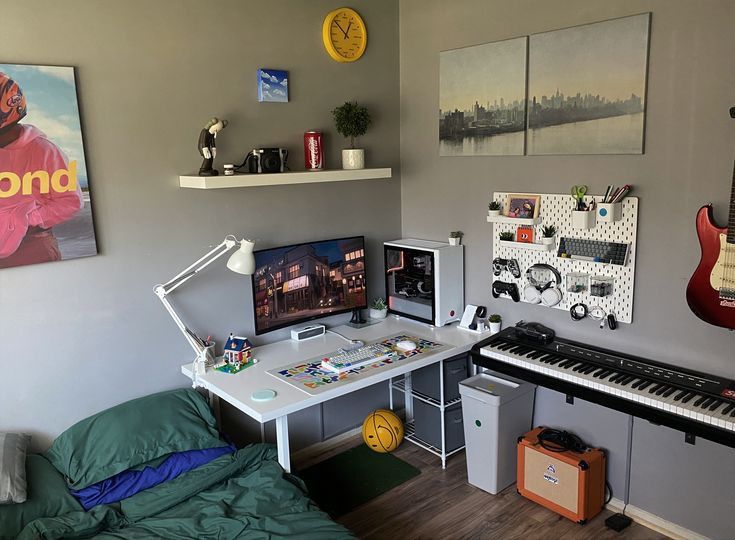 a bedroom with a bed, desk and guitar on the wall next to two pictures