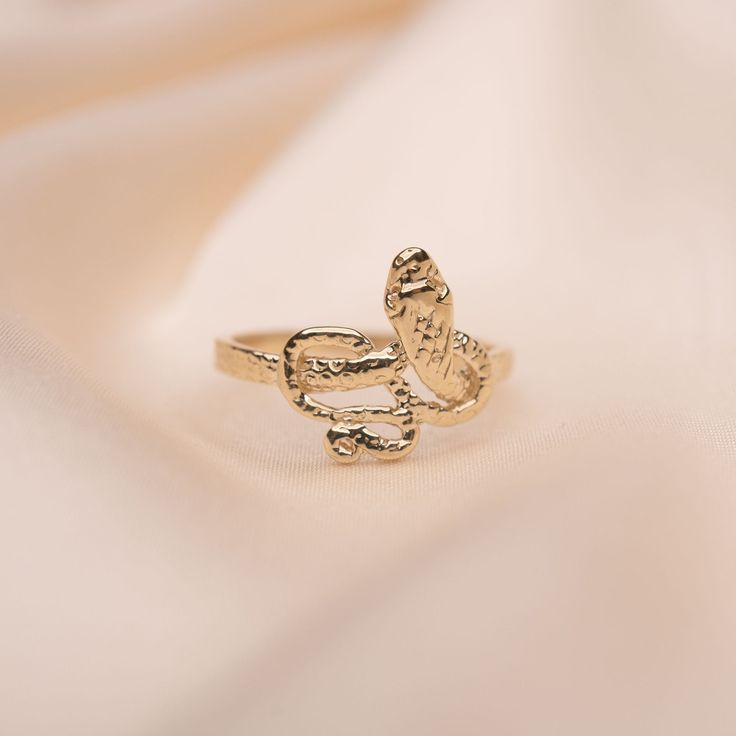 Our 14k Gold Serpent Ring is finely handcrafted with care. This uniquely designed ring adds an interesting look to your collection. 14k Solid Gold Available in 14k Yellow Gold or 14k White Gold Due to the handmade nature of this ring, please allow 1 - 2 weeks for processing. Serpent Ring, Handmade Natural, Heart Ring, Solid Gold, Wedding Rings, White Gold, Yellow Gold, Engagement Rings, Ring