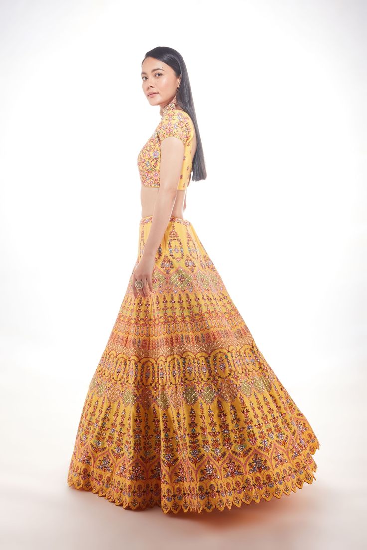 A yellow silk lehenga with fine multi-hued resham embroidery with a touch of sequins and glass beads paired with a matching blouse and mauve pink net dupatta From Chamee and Palak 's The Wedding Edit collectionDELIVERY TIMEPlease allow 8-12 weeks for your outfit to arrive.FABRIC DETAILSSilk And NetProfessional cleaning only. Yellow Dress With Dupatta For Reception, Yellow Georgette Anarkali Set With Intricate Embroidery, Yellow Silk Traditional Wear With Intricate Embroidery, Yellow Embroidered Dress For Reception, Designer Yellow Anarkali Set With Intricate Embroidery, Yellow Choli With Resham Embroidery In Traditional Drape, Reception Yellow Sharara With Intricate Embroidery, Yellow Sets With Intricate Embroidery For Reception, Yellow Resham Embroidered Lehenga For Festive