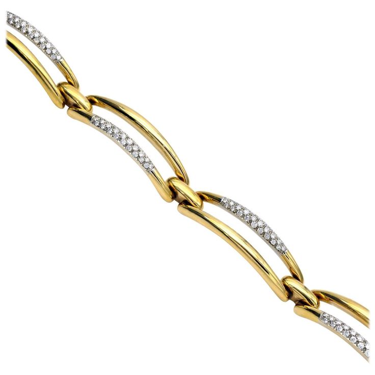 Comprised of four geometric 18KT yellow gold elements on which a white gold inlayed band is set with diamonds. This bracelet has a simple yet strong modern design. Diamonds : approx. 2 carats G+ VS Formal Link Gold Bracelet With Diamond Accents, Formal Gold Link Bracelet With Diamond Accents, Modern White Diamond Bracelet For Formal Occasions, Modern Diamond Bracelet With Diamond Cut, Modern Diamond Cut Diamond Bracelet, Modern Gold Bracelet With Pave Setting, Modern Diamond Cut Bracelet For Anniversary, Modern Gold Bracelet With Diamond Accents For Anniversary, Modern Diamond Cut Diamond Bracelet For Formal Occasions