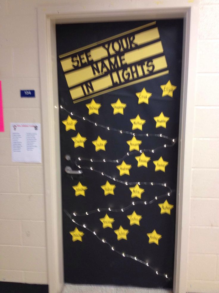 a door decorated with yellow stars and the words see your name in lights