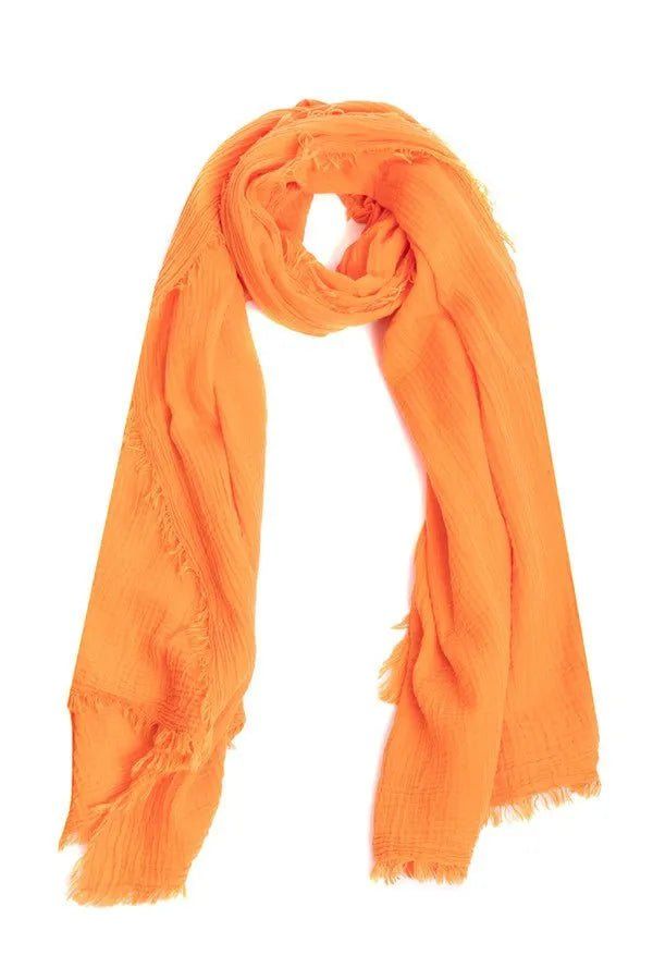 Our Solid Cotton Fringed Scarf, made from 100% cotton, is incredibly soft, comfortable, and breathable, making it perfect for transitional months and summer. It features fringed edges that add a touch of texture and dimension to the scarf, and the generous size of the scarf allows for versatility in styling, whether you want to drape it over your shoulders as a shawl, tie it around your neck, or wear it as a sarong. Choose from a range of beautiful pastels and bright colors that are perfect for Trendy Cotton Summer Scarves, Trendy Cotton Scarves For Summer, Trendy Cotton Scarf For Summer, Trendy Summer Cotton Scarves, Solid Cotton Scarf For Spring, Lightweight Cotton Casual Scarves, Casual Lightweight Cotton Scarves, Lightweight Cotton Casual Scarf, Casual Orange Summer Scarf