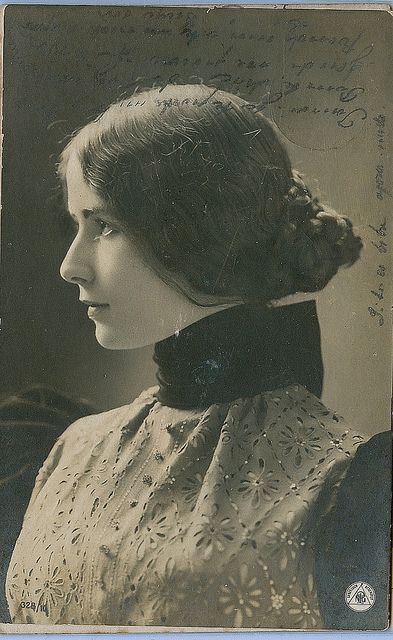 an old black and white photo of a woman