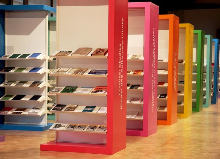 there are many different colored shelves in the store