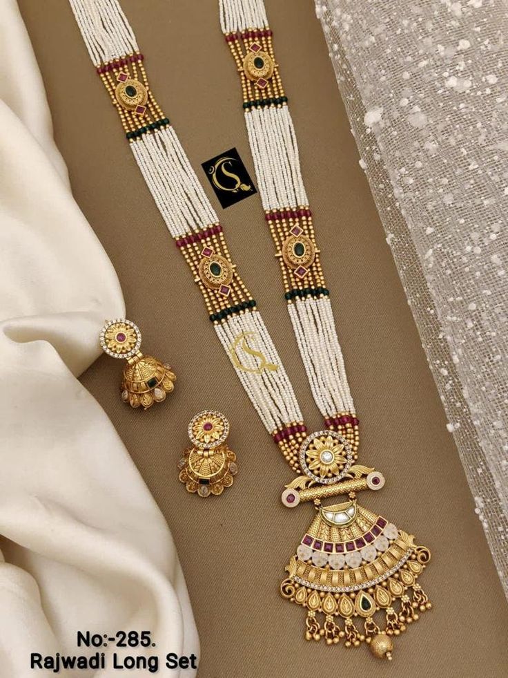 Description :- Guttapusalu Necklace/ Temple Necklace/ Gold Long Necklace/ Indian Necklace/ Temple jewerly/ Indian Jewelry/ Wedding Sets Gift yourself a royal look with this perfectly crafted kundan necklace set from Manalisstudio. Crafted with high quality kundan stones and pearls, it is impressive in design. The green enamel artwork adds perfect texture to the design. Perfect for weddings and festivities, this antique necklace set should be put on with your favorite sari or lehenga. 100% Satisf Luxury Gold Temple Necklace For Statement Jewelry, Luxury Temple Jewelry Sets With Pendant, Luxury Gold Temple Necklace For Reception, Luxury Temple Jewelry For Marriage, Luxury Gold Plated Pendant Temple Necklace, Luxury Brass Temple Necklace For Weddings, Luxury Temple Jewelry Necklace With Intricate Design, Luxury Temple Jewelry Necklaces For Marriage, Luxury Temple Jewelry Bridal Necklace For Anniversary