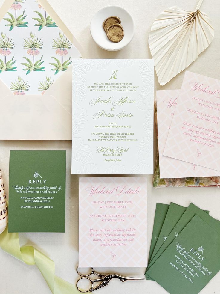 the wedding stationery is laid out on the table