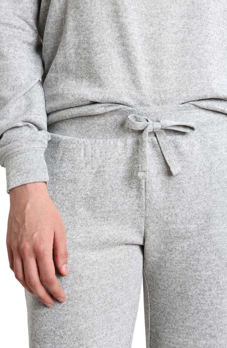 Some long pajamas feature a soft knit design against a crewneck top and matching jogger styled pants. Top has crewneck, long sleeves Pants have elastic waist 97% polyester, 3% spandex Machine wash, tumble dry Imported Model stats: 5'10" height, 32" bust, 25" waist, 36" hip. Model is wearing size S. Gray Sweats With Ribbed Cuffs For Lounging, Comfortable Gray Sweats For Loungewear, Comfortable Sweats With Elastic Cuffs For Loungewear, Winter Sweats With Elastic Waistband For Loungewear, Cozy Fit Sweatpants With Elastic Cuffs For Loungewear, Gray Sweatpants With Ribbed Cuffs For Loungewear, Comfy Sweats With Elastic Cuffs For Lounging, Cozy Long Sweatpants For Loungewear, Cozy Sweatpants With Elastic Cuffs For Loungewear