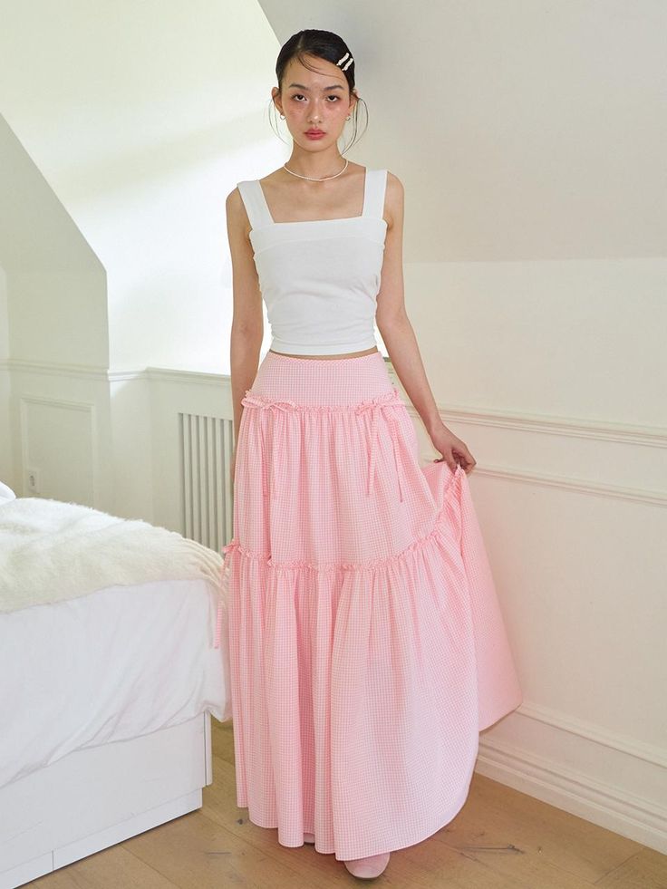 This is a trendy and feminine skirt by SALON DE YOHN that is made out of high quality and sturdy material. With distinctive mood of the design and modern feminine look, you can style it for your comfortable daily outfit.- Ribbon and shirring detail- Light fabric for spring and summer- Feminine and modern mood High Waist Pink Maxi Skirt For Spring, Pink Voluminous Tiered Skirt, High-waist Pink Lined Maxi Skirt, High Waist Pink Pleated Maxi Skirt, High Waist Pink Lined Maxi Skirt, High Waist Pink Maxi Skirt Relaxed Fit, Casual Pink Ruffled Maxi Skirt, Chic Pink Cotton Skirt, Pink High Waist Maxi Skirt For Summer