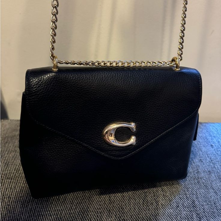 Like New, Black Pebbled Leather Envelope Bag. Convertible Chain Shoulder/Crossbody Strap. Three Compartments Inside And A Small Pocket On The Back - About The Size Of Credit Cards. Love This Bag, Just Have A Couple That Are Similar And It Doesn’t Get Enough Use! Coach Evening Bags With Chain Strap, Chic Coach Shoulder Bag With Chain Strap, Coach Evening Flap Bag With Gold-tone Hardware, Chic Coach Shoulder Bag With Metal Hardware, Coach Crossbody Bag With Chain Strap, Coach Evening Satchel Flap Bag, Chic Coach Bags With Chain Strap, Elegant Coach Flap Bag With Gold-tone Hardware, Coach Formal Shoulder Bag With Chain Strap